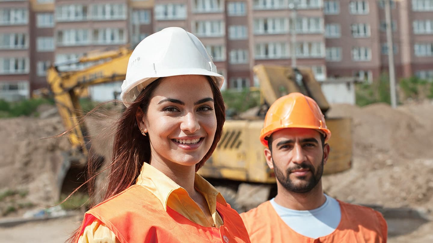 Site safety lead reviewing documentation on an industrial site