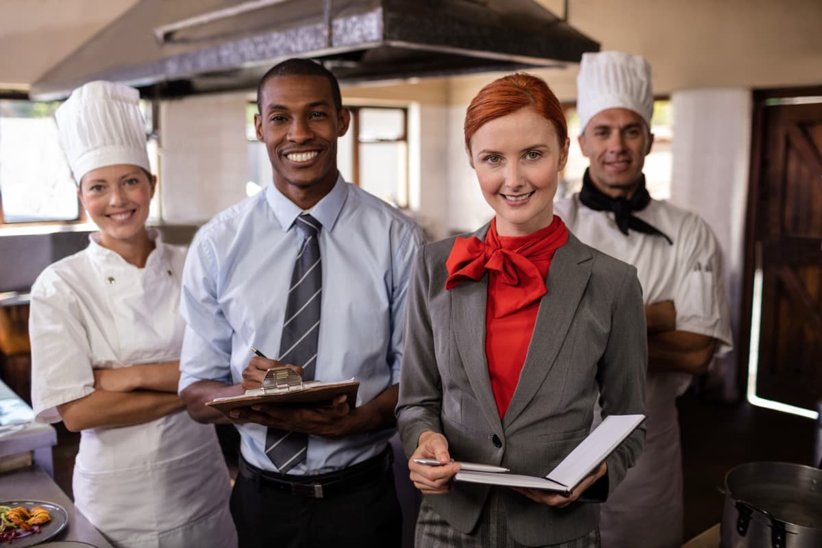 Hospitality and food-service professionals in a training kitchen